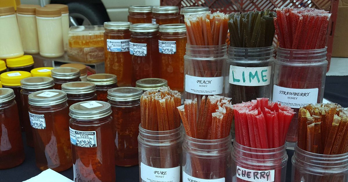 Jars with flavored honey sticks